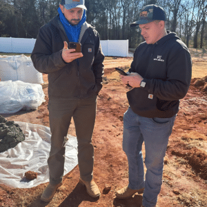 concrete contractor working with a trade partner to estimate the cost of adding stamped concrete to a project and develop concrete pricing for customer