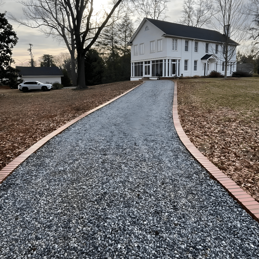 gravel driveway with brick boarder